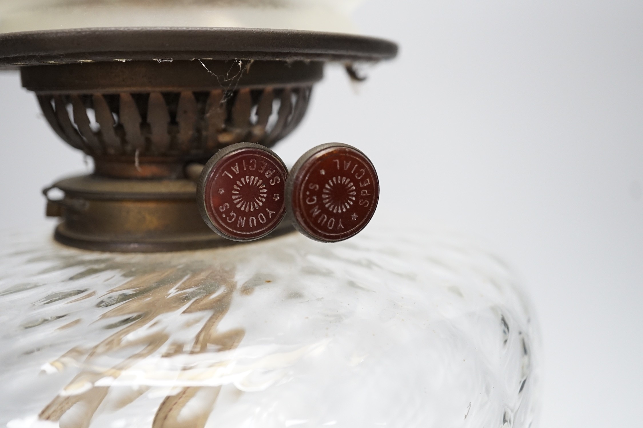A Victorian brass stemmed oil lamp and glass shade, 50cms including shade